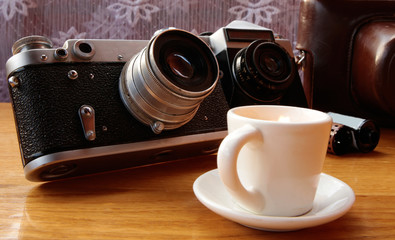 Vintage camera on wooden table
