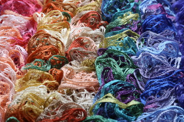 Fototapeta premium Many different colors in one place crocheted colored scarf