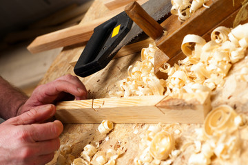 carpenter working,hammer,meter and screw-driver on construction background