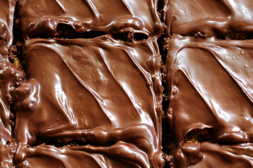 Chocolate brownies close up cut into single servings