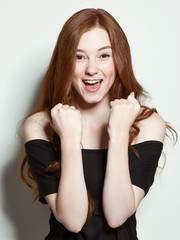 Fototapeta premium The young red-haired girl