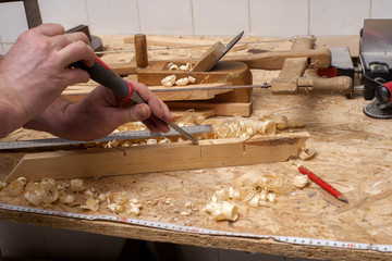 carpenter working,hammer,meter and screw-driver on construction background