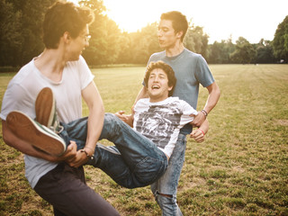 group of friends together in a park having fun