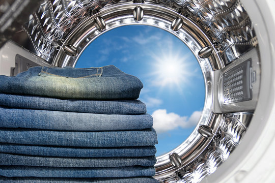 Closeup Group Of Blue Jeans Inside The Washing Machine.