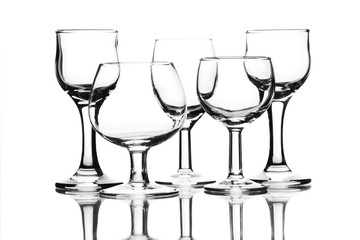 Set of empty glasses on white