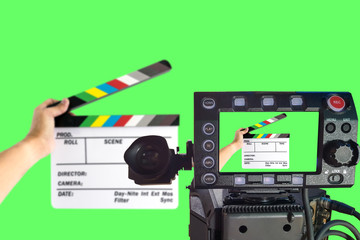 LCD monitor on the camera focus at a hand holding camera slate  for the filming isolated on green background.