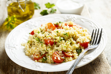 Bulgur salad with cherry tomatoes and herbs