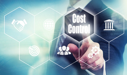 A businessman selecting a Cost Control Concept button