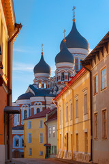 Fototapeta na wymiar Russian Orthodox Alexander Nevsky Cathedral and narrow street of Old Town Toompea in the evening, Tallinn, Estonia