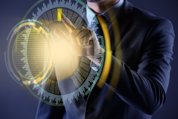 Businessman pressing virtual button in futuristic concept