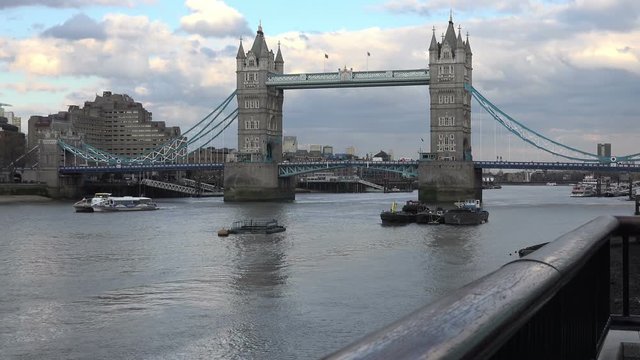 Tower bridge with traffic and passersby, London, UK, April 2016