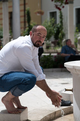 man preparing for ablution