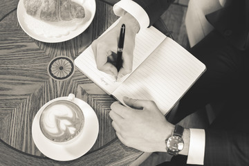 coffee break with a cap of coffee and croisant