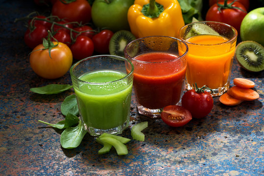 assortment of vegetable juices on a blue background