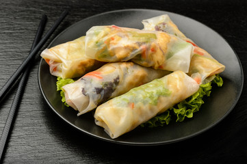 Spring rolls with vegetables and chicken - traditional vietnamese cuisine.