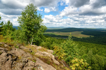 Fototapeta na wymiar View of forest, mountains, fields from Lipovaya Mount