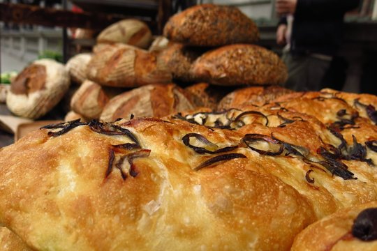 focaccia and assorted fresh baked bread at street market