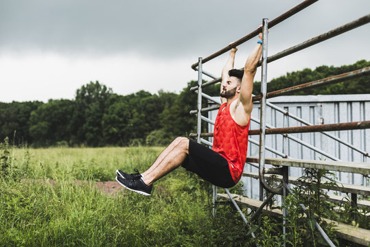Athlete exercising at bleachers