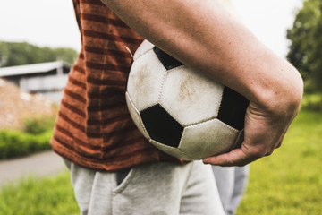 Close-up of man holding soccer ball