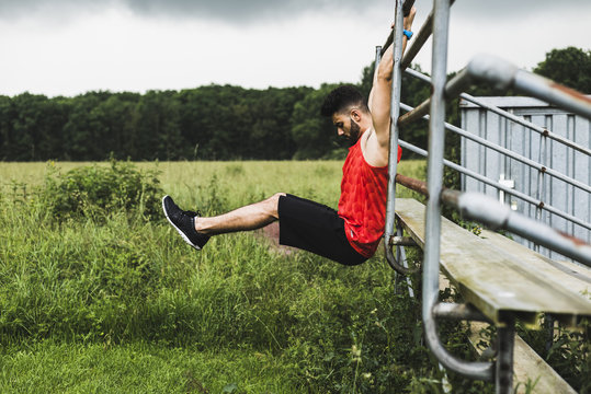 Athlete exercising at bleachers