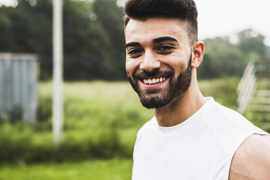 Portrait of smiling athlete outdoors