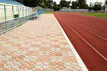 Red running track in stadium