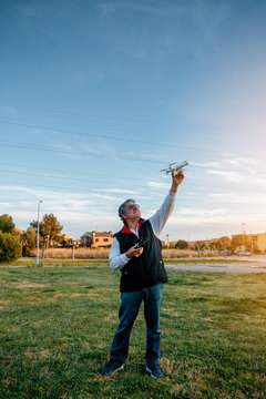 Senior Man Playing wit a Drone