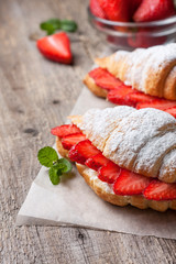 croissant with fresh strawberries, ricotta
