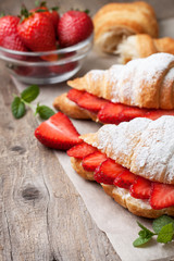 croissant with fresh strawberries, ricotta