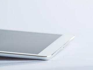 Closeup of tablet on gray background