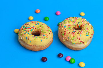 two donuts on blue background