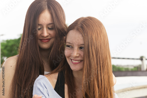 Two Redhead Teen Sisters In The Street Having Fun Imagen
