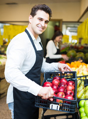 Fototapeta premium sellers offering seasonal sweet apples in grocery
