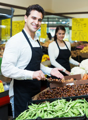 Woman and man standing near chestnuts