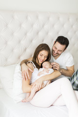 Happy family with newborn baby