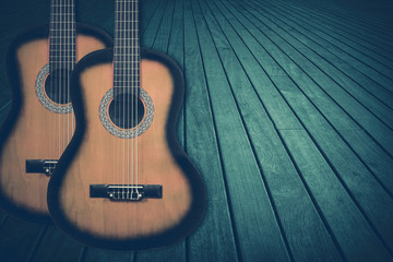 Obraz premium Part of a blue acoustic guitar on a wooden background.