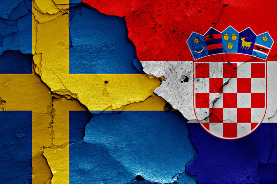 flags of Sweden and Croatia painted on cracked wall