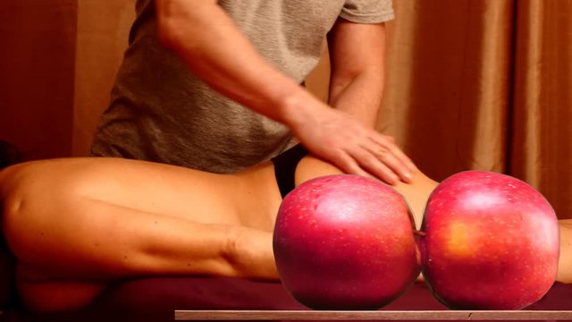 Erotic Massage of sexy half naked woman with funny indecent apples motion on table 