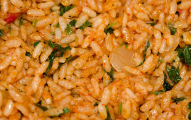 Raw rice and the other ingredients to fill vine leaves to prepare 