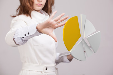Woman shows a pie chart, circle diagram. Business analytics concept.