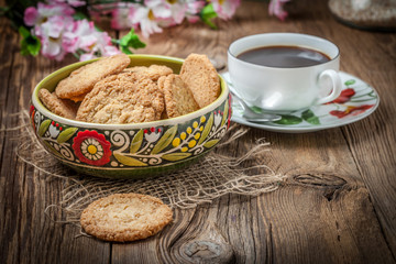 Stack of freshly baked oat biscuits in a bowl.