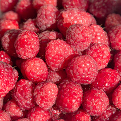 Ripe raspberries on a plate. Selective soft focus