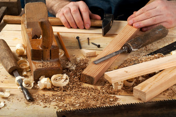Carpenter tools on wood table background. Top view. Copy space