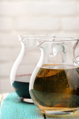 Cold juice in glass jars on white background