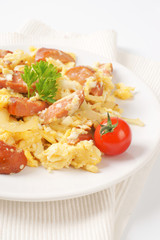 scrambled eggs with sliced sausage