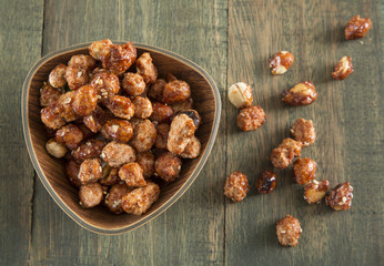 sugared peanuts on the wooden background