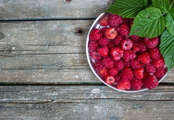 raspberries in a metal plate