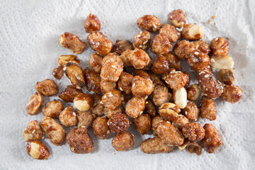 sugared peanuts on white background