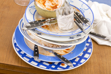 Table with several dirty dishes arranged on it