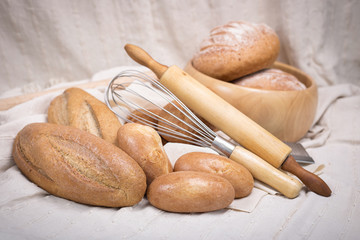 Fresh homemade bread in a cotton cloth background